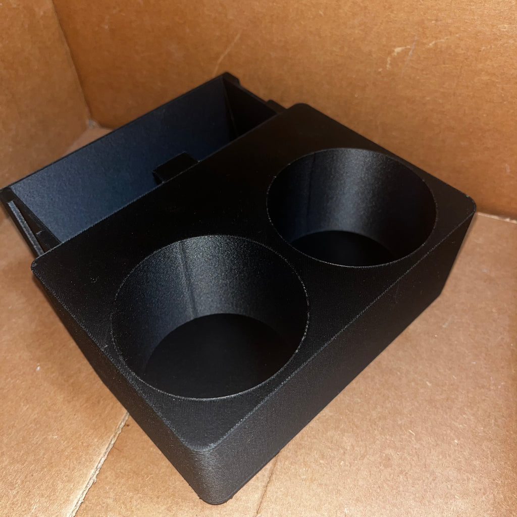 Center console cupholders in a brown cardboard box